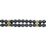 An 18ct gold pearl and diamond bracelet.Estimated total diamond weight 0.20ct.