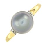 A cultured pearl and diamond dress ring.Cultured pearl measuring 9mms.