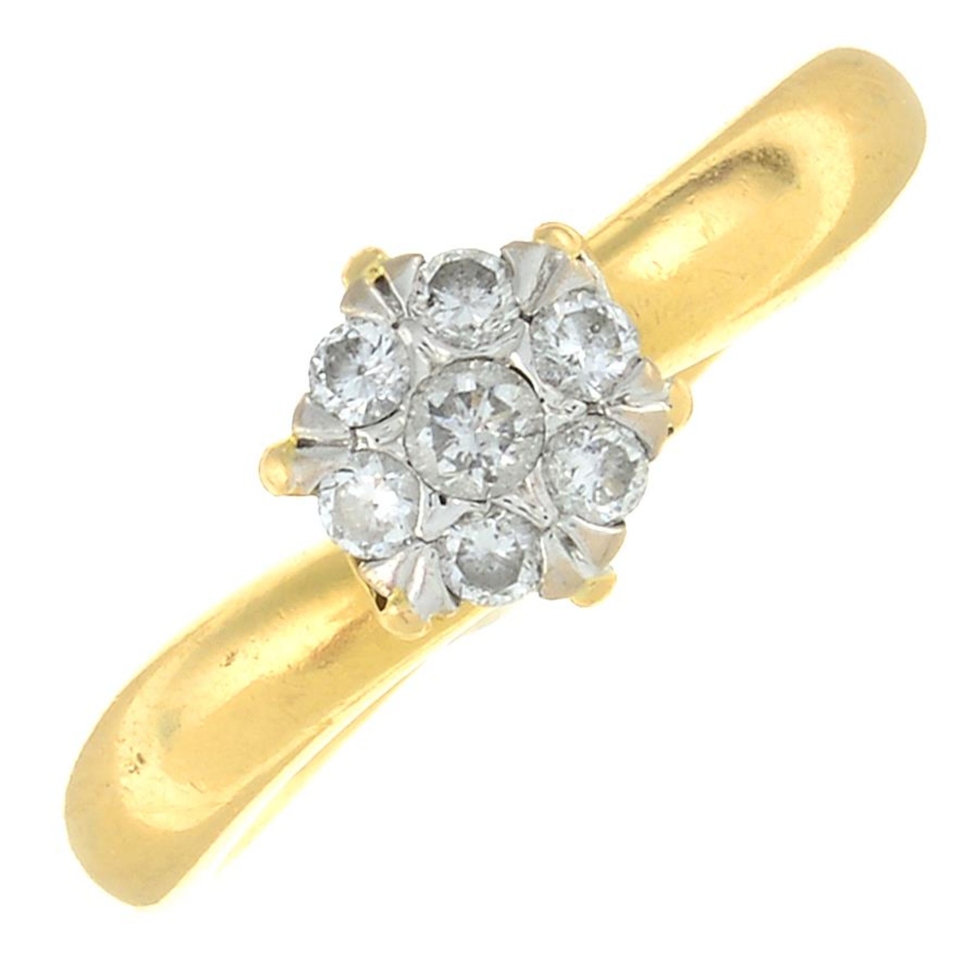 An 18ct gold diamond cluster ring.Estimated total diamond weight 0.15ct.