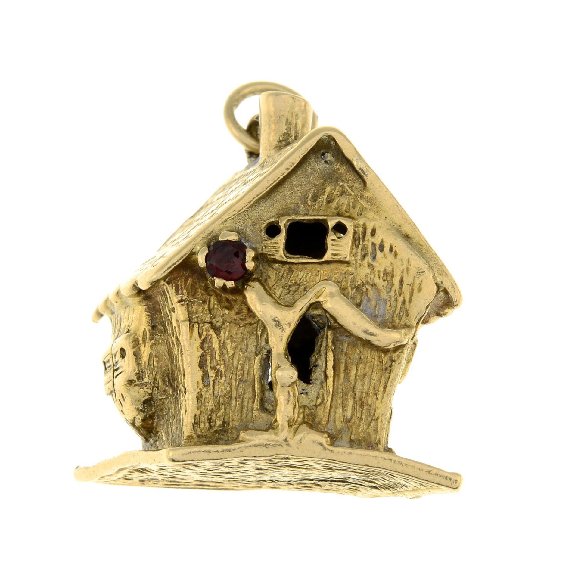 A 9ct gold brown paste house charm.Hallmarks for London, 1963.Length 3cms.