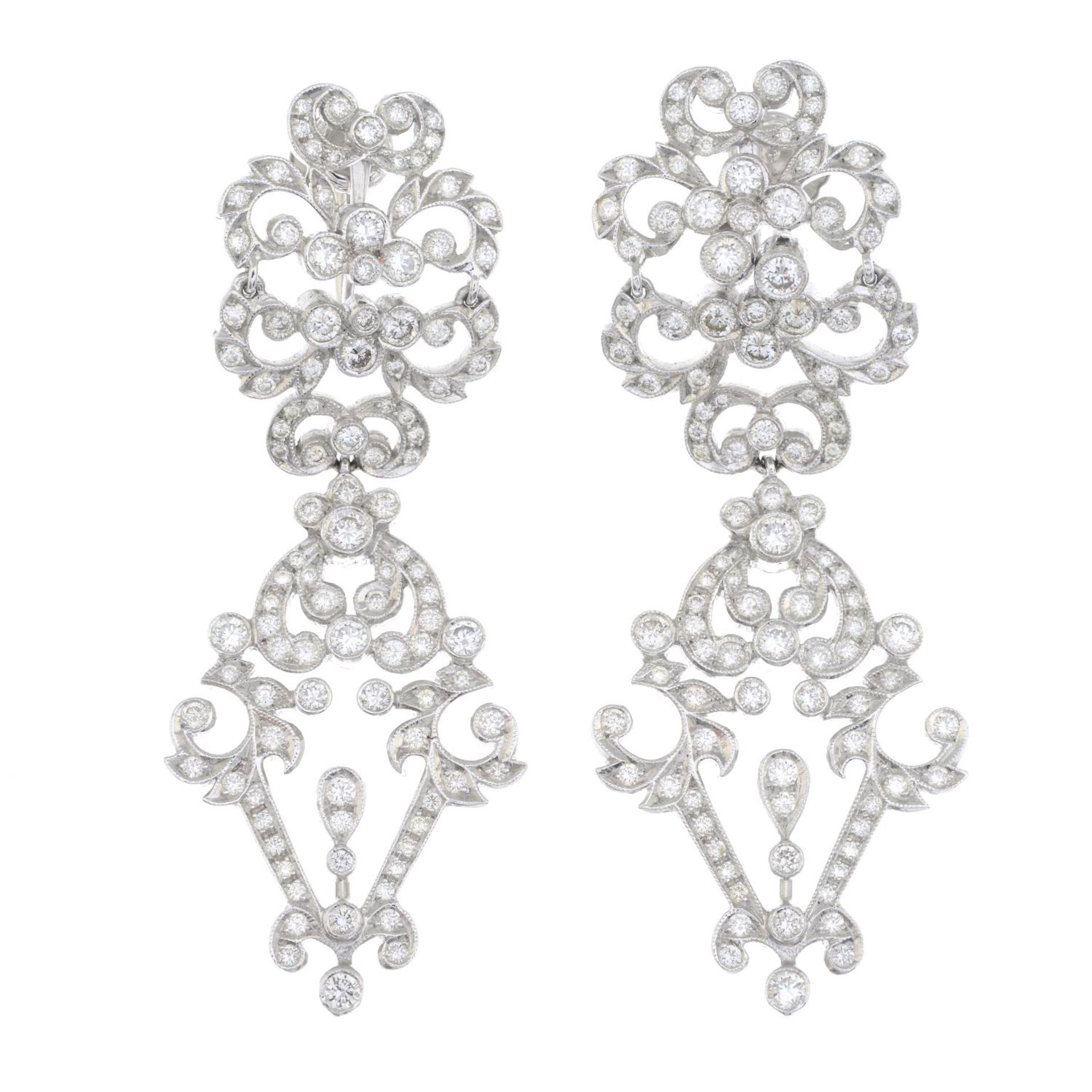 A pair of brilliant-cut diamond stylised foliate earrings.Estimated total diamond weight 2.50cts,