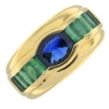 A sapphire and emerald dress ring.Sapphire calculated weight 0.79ct,