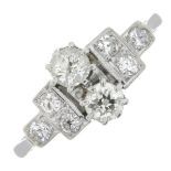 An Art Deco 18ct gold and platinum old-cut diamond two-stone ring, with single-cut diamond sides.