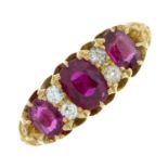 An Edwardian 18ct gold Thai ruby three-stone and diamond ring.Verbal from GCS,