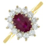 An 18ct gold ruby and brilliant-cut diamond cluster ring.Total diamond weight 0.47ct,