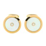 A pair of mother-of-pearl and brilliant-cut diamond disc cufflinks.Total diamond weight 0.10ct,
