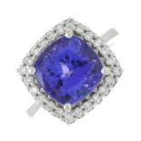 An 18ct gold tanzanite and brilliant-cut diamond cluster ring.Tanzanite calculated weight 5.92cts,