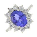 A tanzanite and brilliant-cut diamond cluster ring.Tanzanite calculated weight 2.03cts,