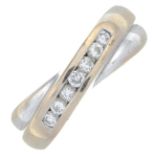 An 18ct gold brilliant-cut diamond crossover ring.Total diamond weight 0.25ct, stamped to band.