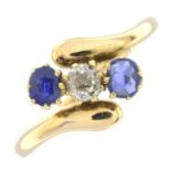 An early 20th century 18ct gold old-cut diamond and sapphire three-stone crossover ring.Estimated