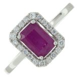 An 18ct gold ruby and brilliant-cut diamond cluster ring.Ruby weight 1.11cts.Total diamond weight