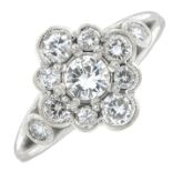 A brilliant-cut diamond cluster ring.