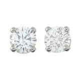 A pair of brilliant-cut diamond single-stone stud earrings.Estimated total diamond weight 0.70ct,