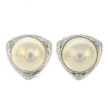 A pair of mabe pearl and diamond clip earrings.