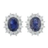 A pair of 18ct gold sapphire and brilliant-cut cluster earrings.Total diamond weight 0.82ct,