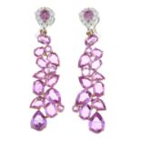 A pair of 18ct gold pink sapphire and diamond 'Beneath the Rose' earrings.Estimated total diamond