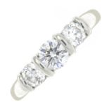 A platinum brilliant-cut diamond three-stone ring.Estimated total diamond weight 0.75ct,