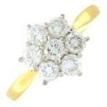 (66957) An 18ct gold brilliant-cut diamond cluster ring.Total diamond weight 1cts,