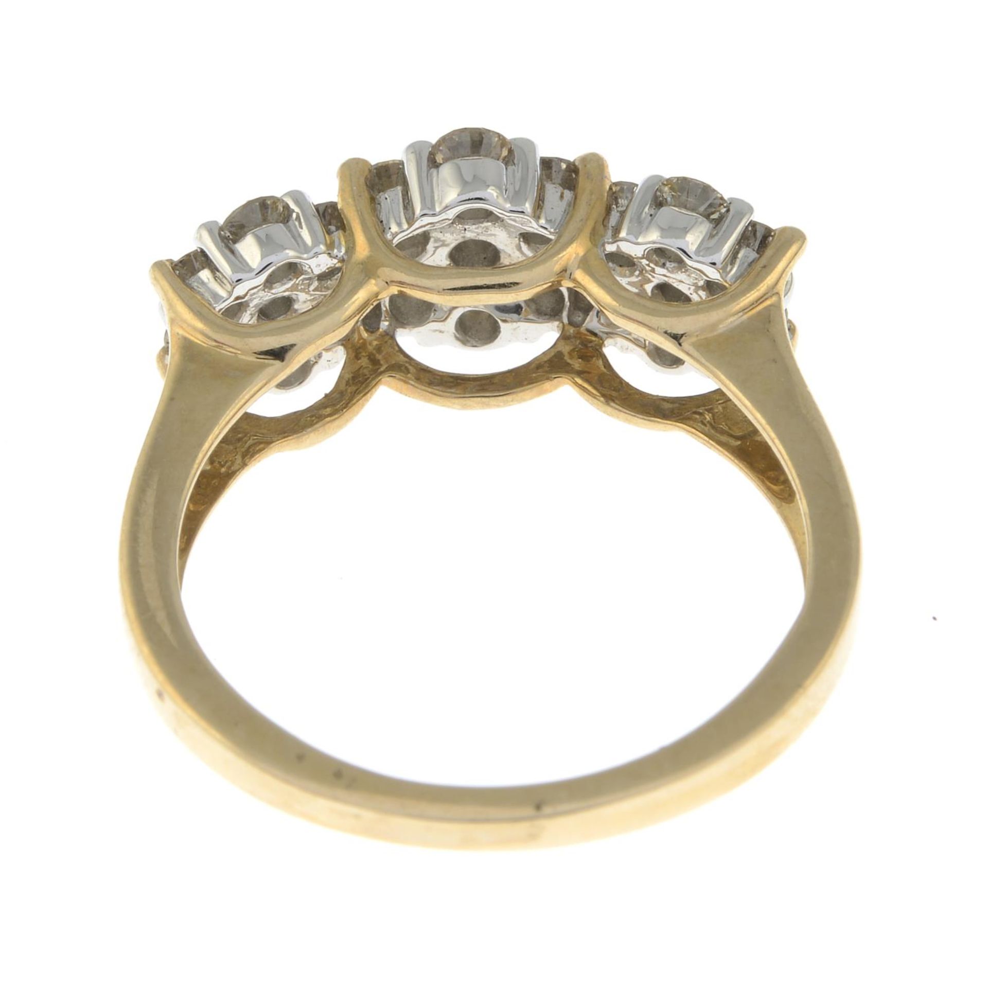 A brilliant-cut diamond triple cluster ring. - Image 2 of 3
