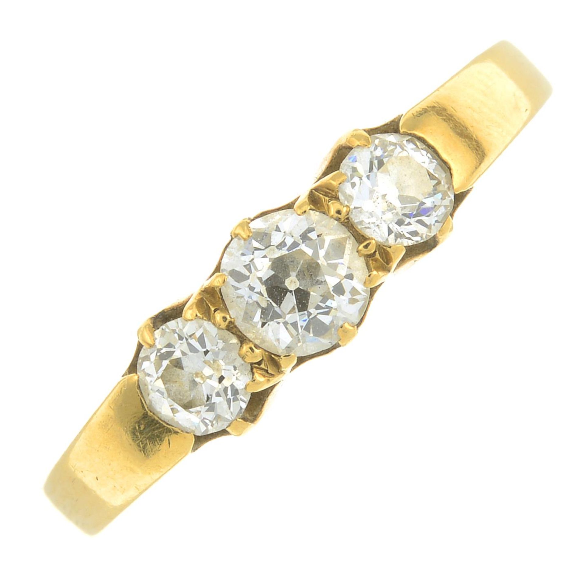 An old-cut diamond three-stone ring.