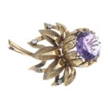 An amethyst and brilliant-cut diamond floral brooch.Amethyst calculated weight 16.2mms,