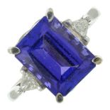 An18ct gold tanzanite and triangular-shape diamond three-stone ring.Tanzanite calculated weight