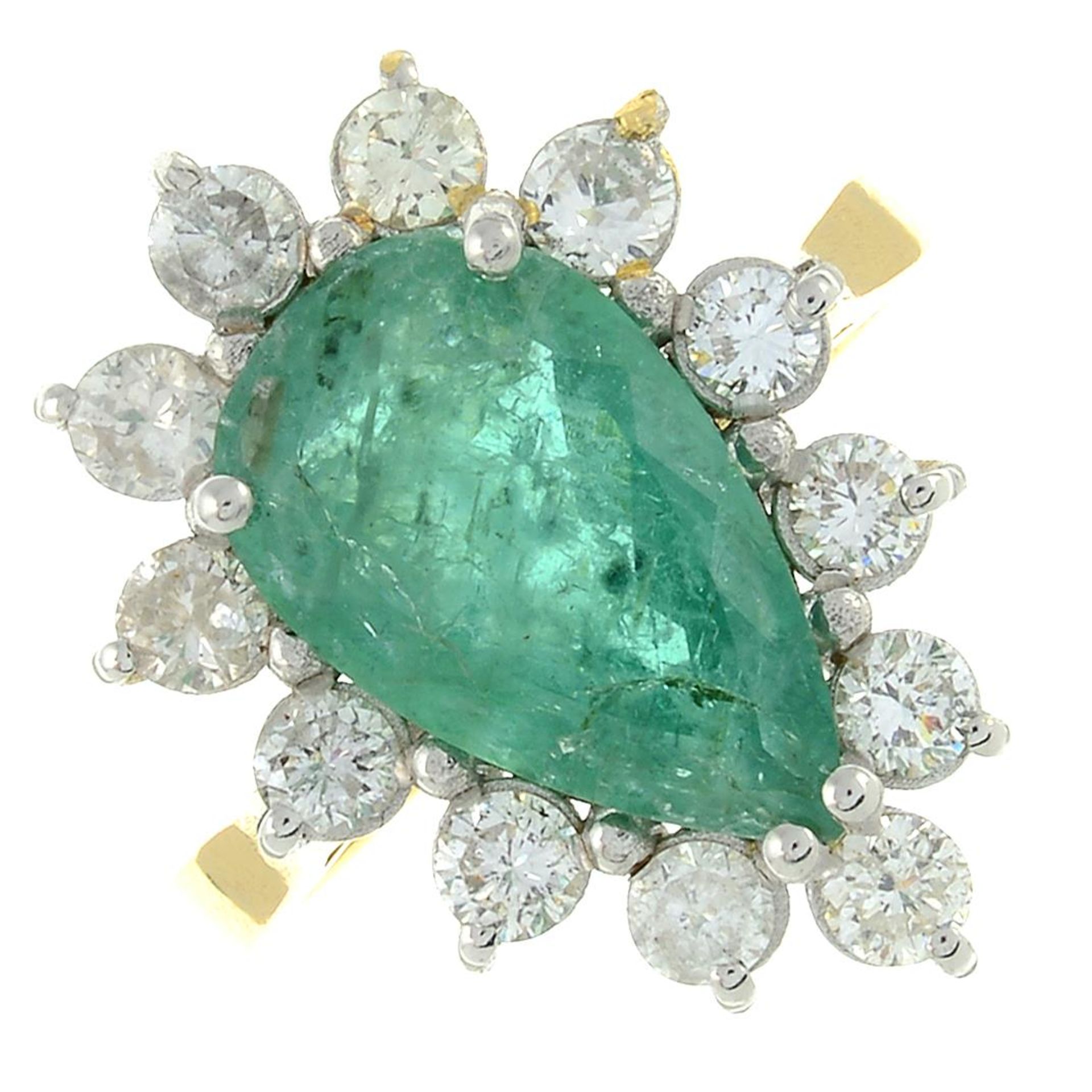 An emerald and brilliant-cut diamond cluster ring.Emerald calculated weight 2.46cts,