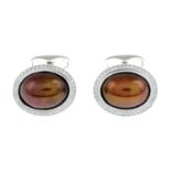 A pair of 'brown' pearl and brilliant-cut diamond oval-shape cufflinks.Total diamond weight 0.42ct,