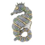 A sapphire and demantoid garnet seahorse brooch.