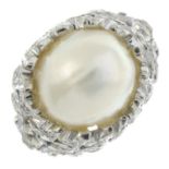 A cultured pearl and brilliant-cut diamond dress ring.Approximate cultured pearl dimensions 10.4 by