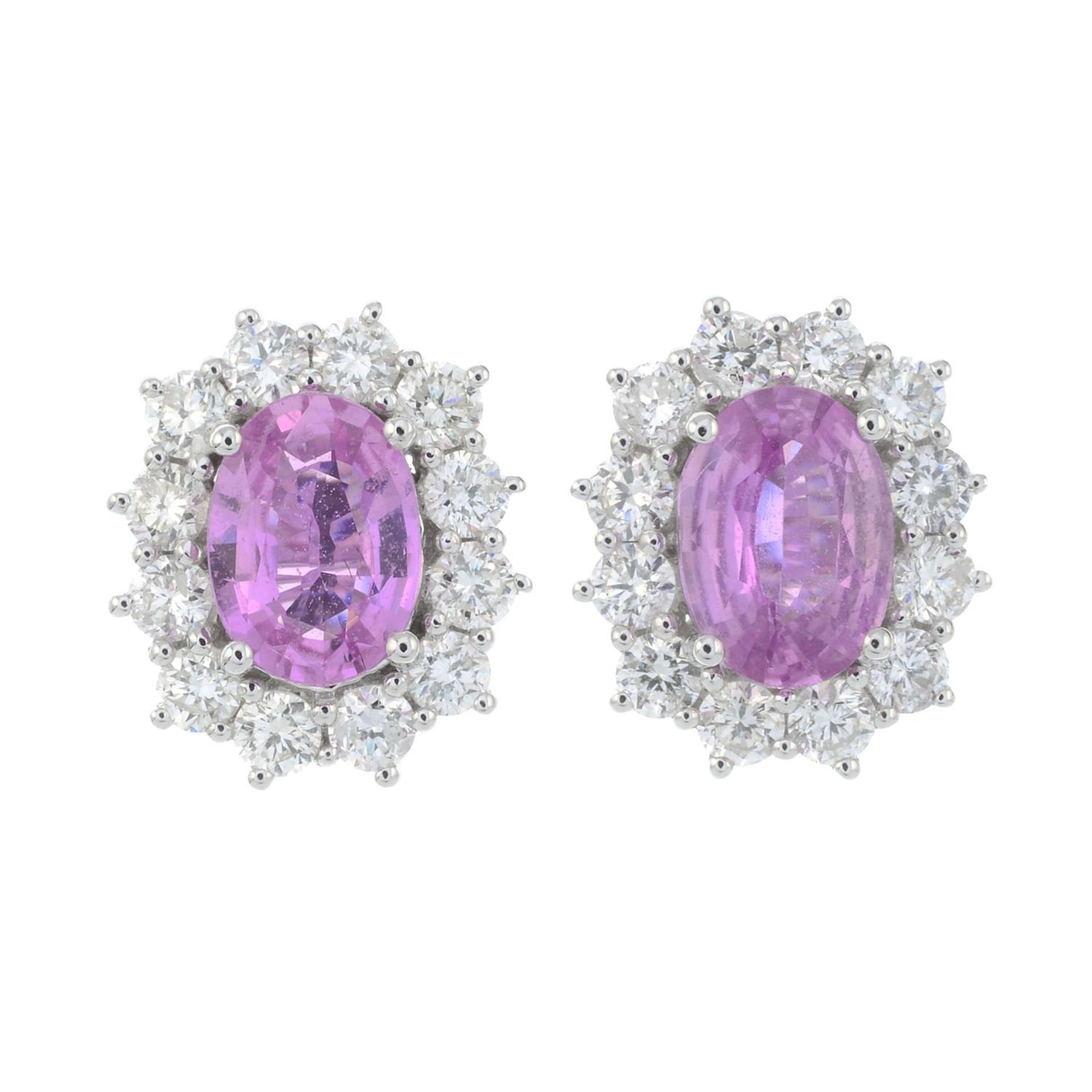 A pair of 18ct gold pink sapphire and brilliant-cut diamond cluster earrings.Total diamond weight