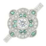An 18ct gold brilliant-cut diamond and emerald cluster ring.Total diamond weight 0.38cts,