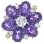 An 18ct gold amethyst and brilliant-cut diamond cluster ring.Estimated total diamond weight 0.75ct,