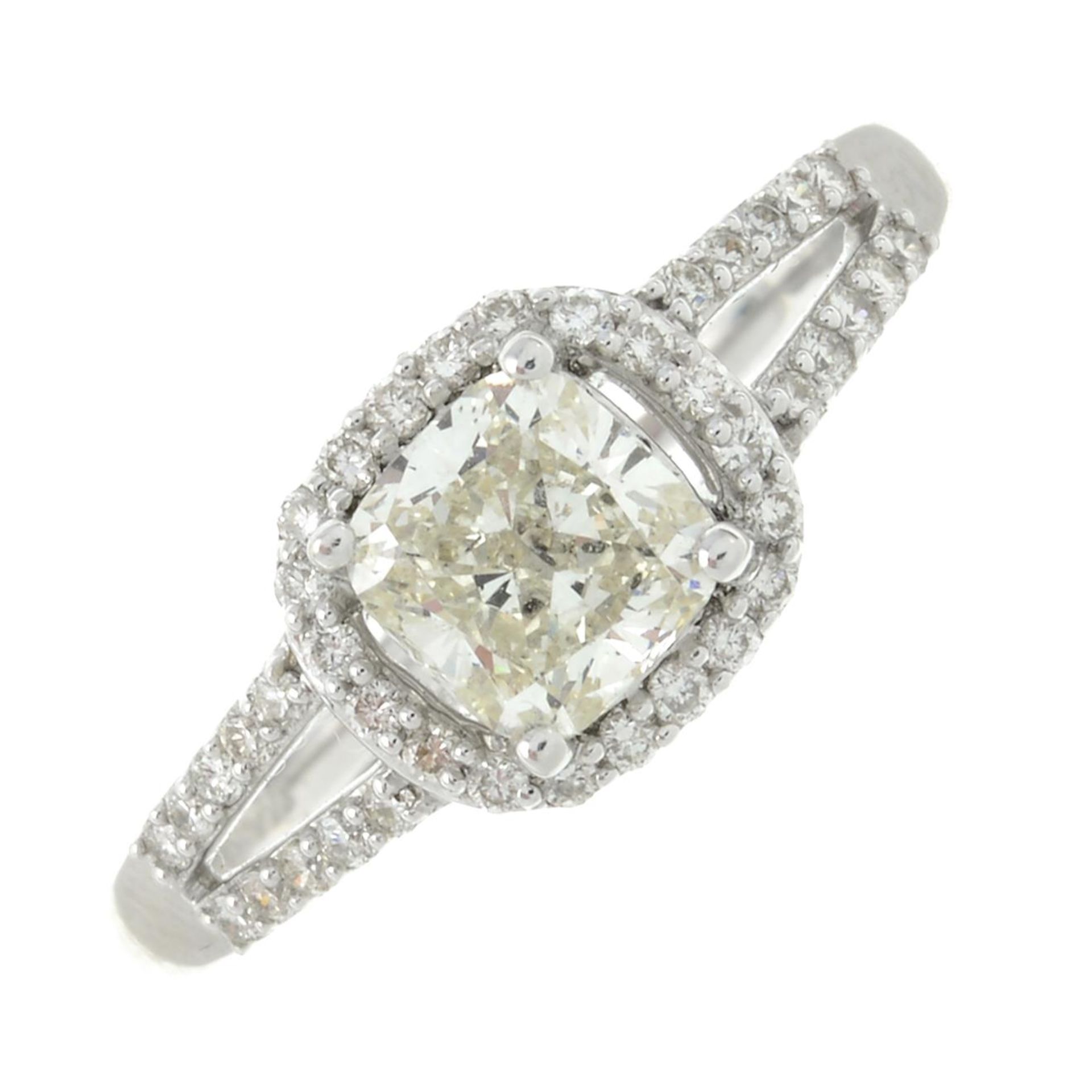 An 18ct gold square-shape diamond ring, within a brilliant-cut diamond surround and sides.