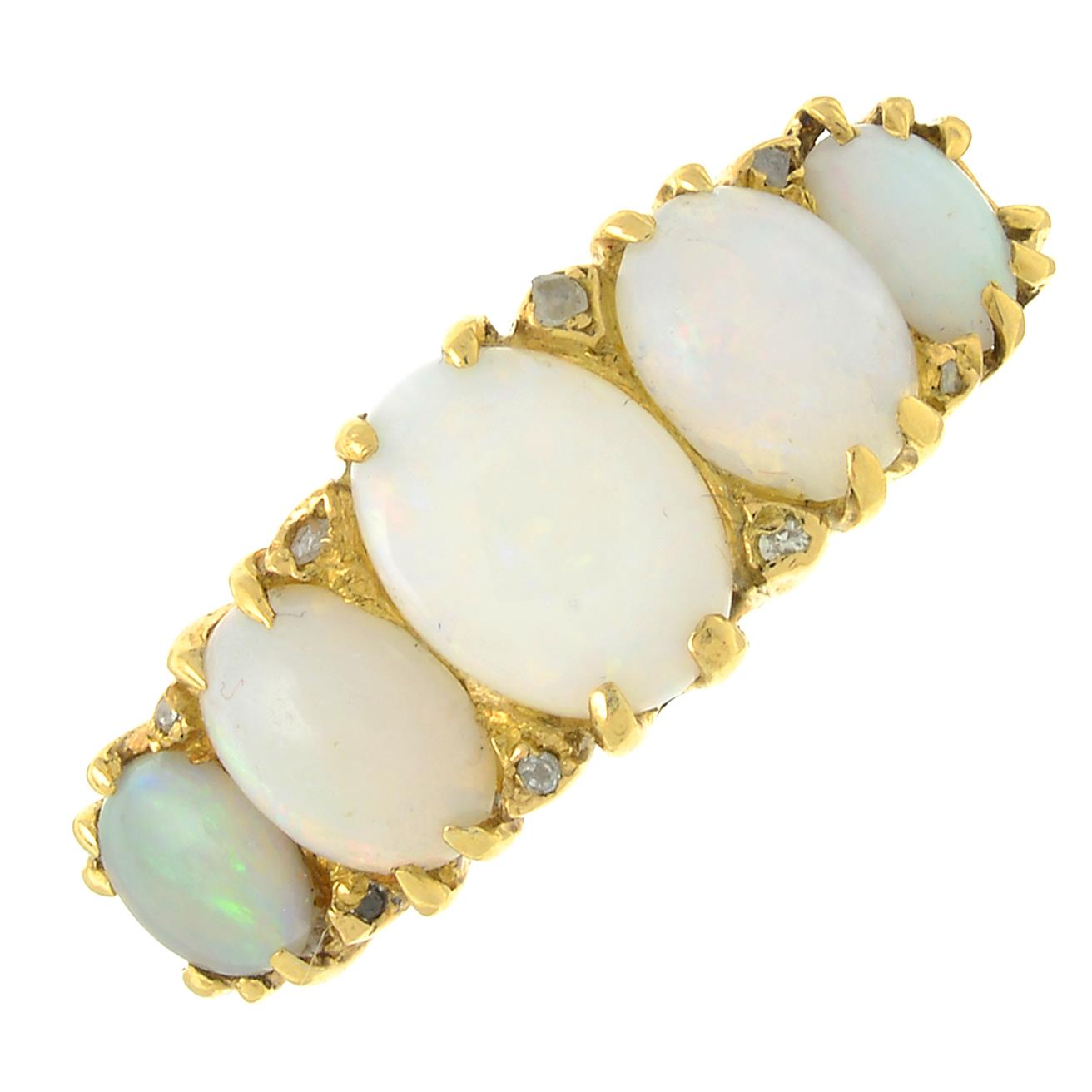 An opal five-stone ring, with diamond point accents.Stamped 18C.Ring size K.