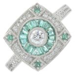 An 18ct gold emerald and brilliant-cut diamond cluster ring.Total diamond weight 0.32ct,