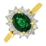 An emerald and brilliant-cut diamond cluster ring.Emerald weight 1.04cts.Total diamond weight