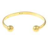 (66949) A 9ct gold cuff bangle.Hallmarks for Birmingham.Inner diameter 6.4cms.