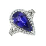 A platinum tanzanite and brilliant-cut diamond cluster ring.Tanzanite calculated weight 6.13cts,