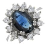 A sapphire and brilliant-cut diamond cluster ring.Sapphire calculated weight 1.56cts,