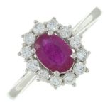 An 18ct gold ruby and brilliant-cut diamond cluster ring.Ruby weight 0.80ct.Total diamond weight