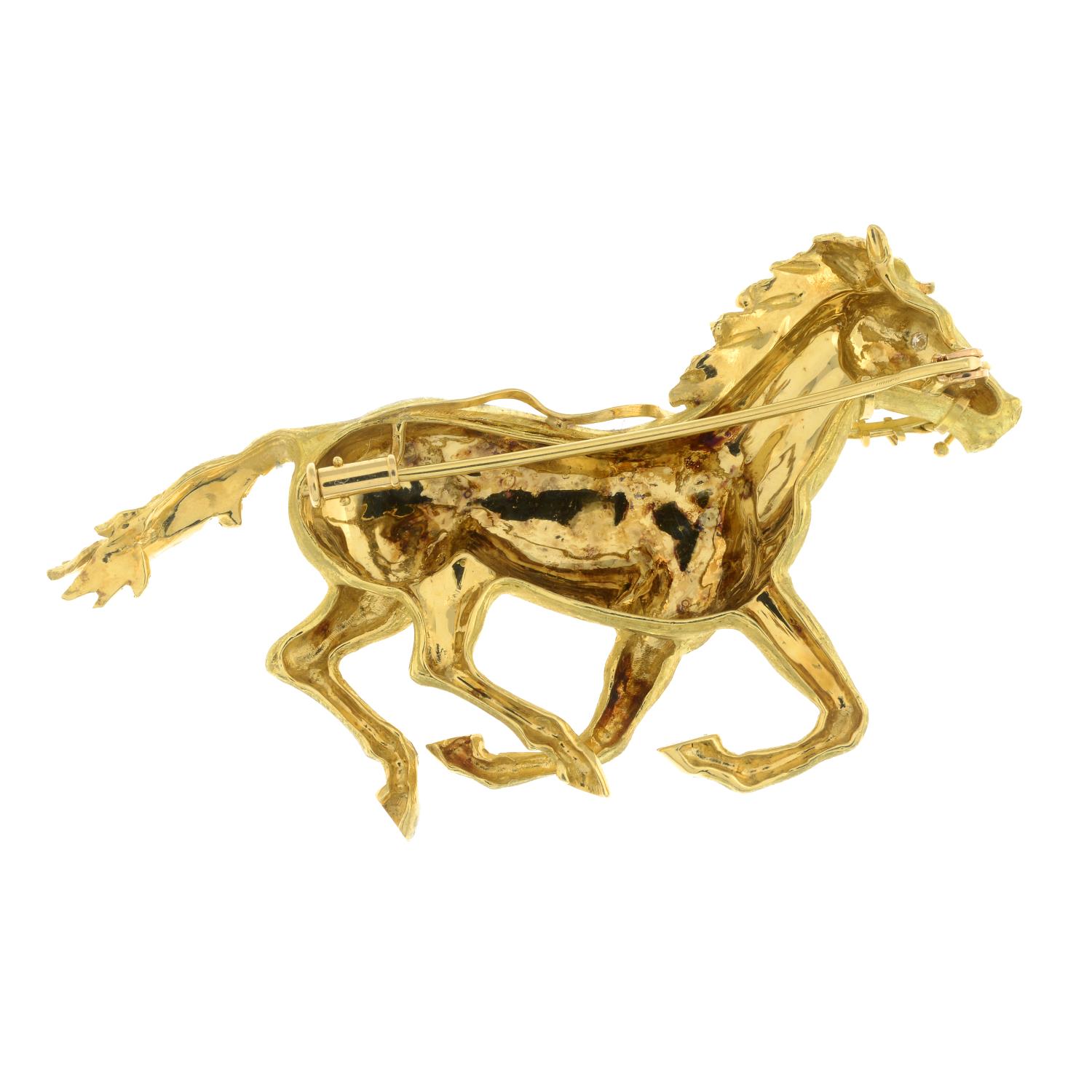 An 18ct gold galloping horse brooch, with diamond accent eye.French assay marks.Length 7.2cms. - Image 2 of 2