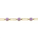 A sugar-loaf amethyst cabochon bracelet.Length 18.3cms 9gms.