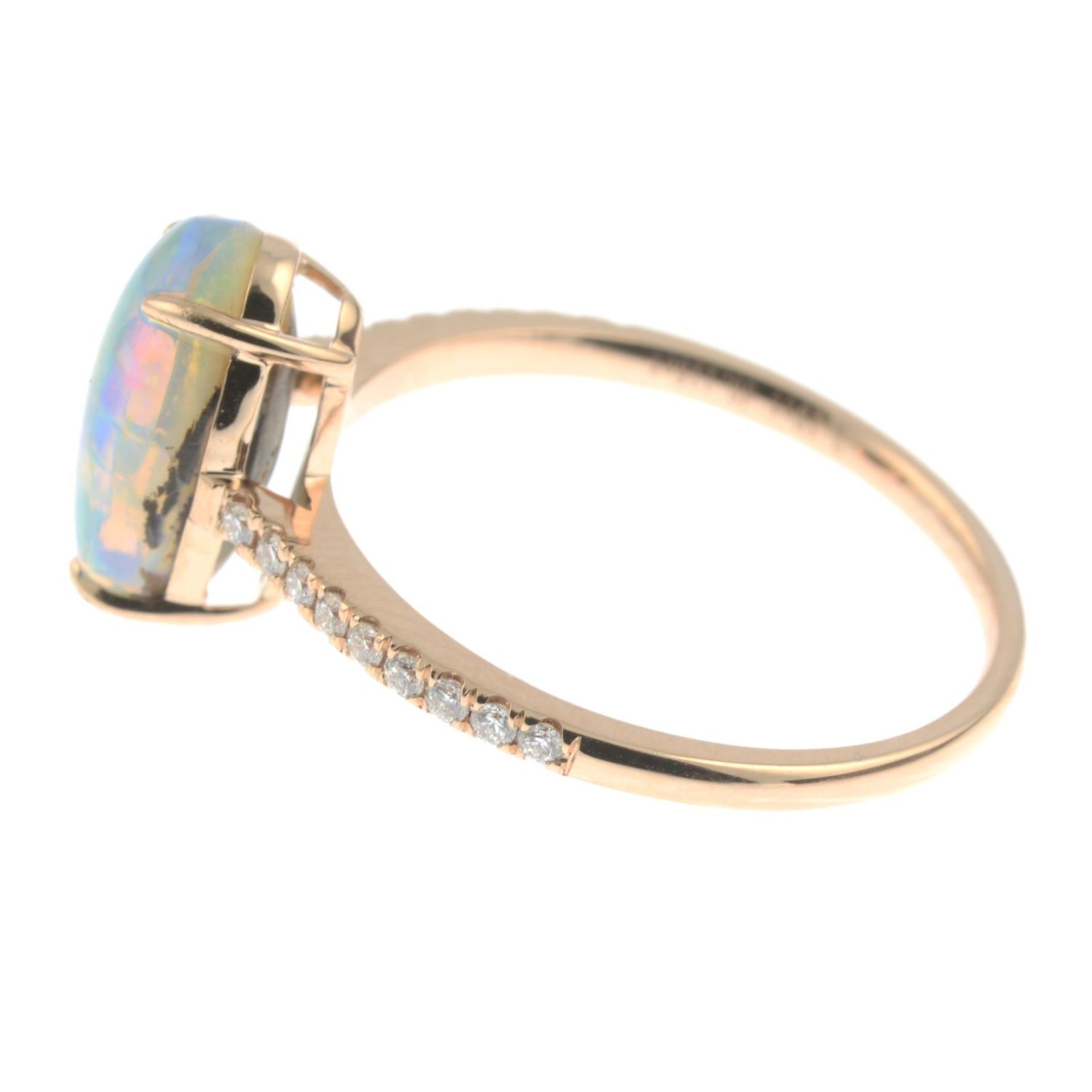 A boulder opal cabochon and brilliant-cut diamond ring.Opal weight 2.19cts stamped to band. - Image 2 of 4