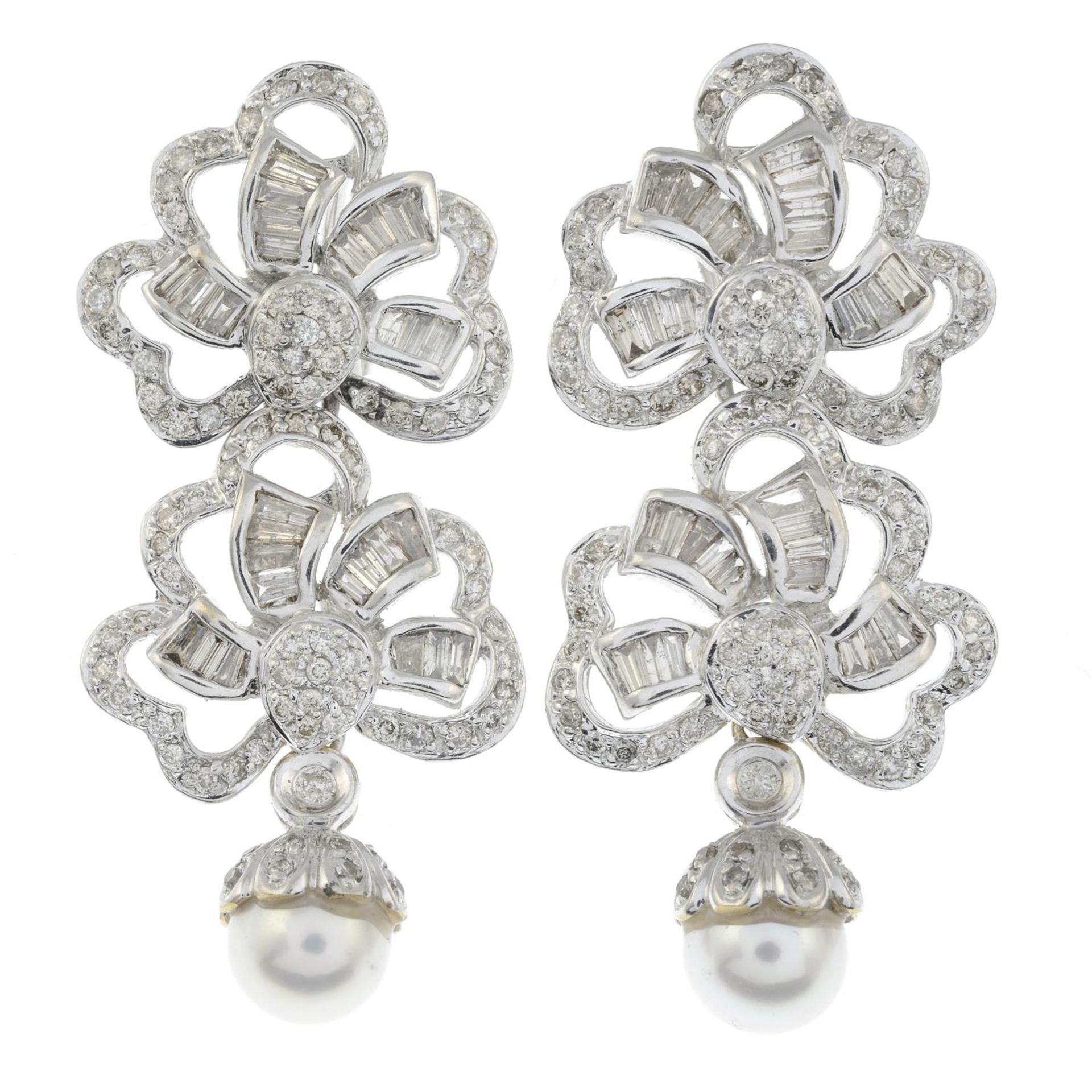 A pair of vari-cut diamond earrings, with cultured pearl drops.
