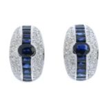 A pair of sapphire and pave-set diamond earrings.Estimated total diamond weight 0.70ct.Stamped