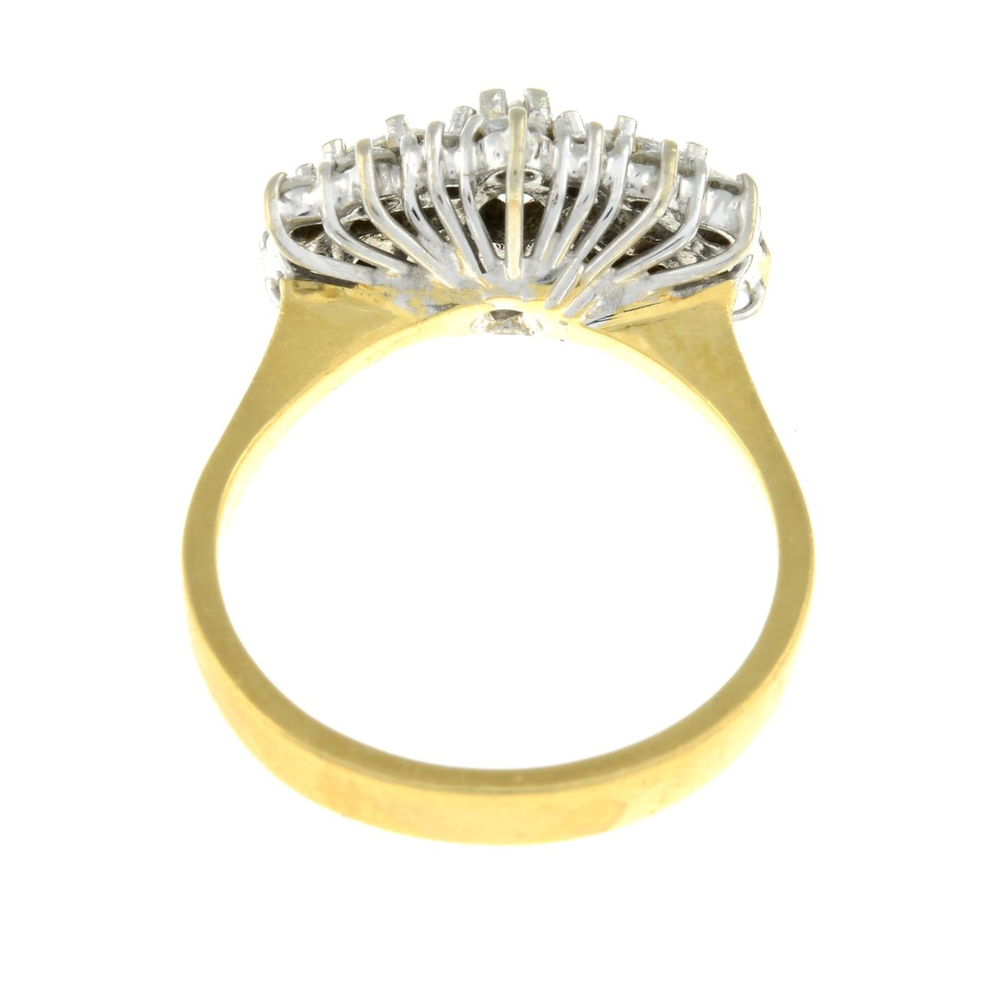 An 18ct gold pear-shape three-stone ring, within a brilliant-cut diamond surround. - Image 3 of 3