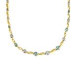 An emerald and brilliant-cut diamond bi-colour necklace.Estimated total diamond weight