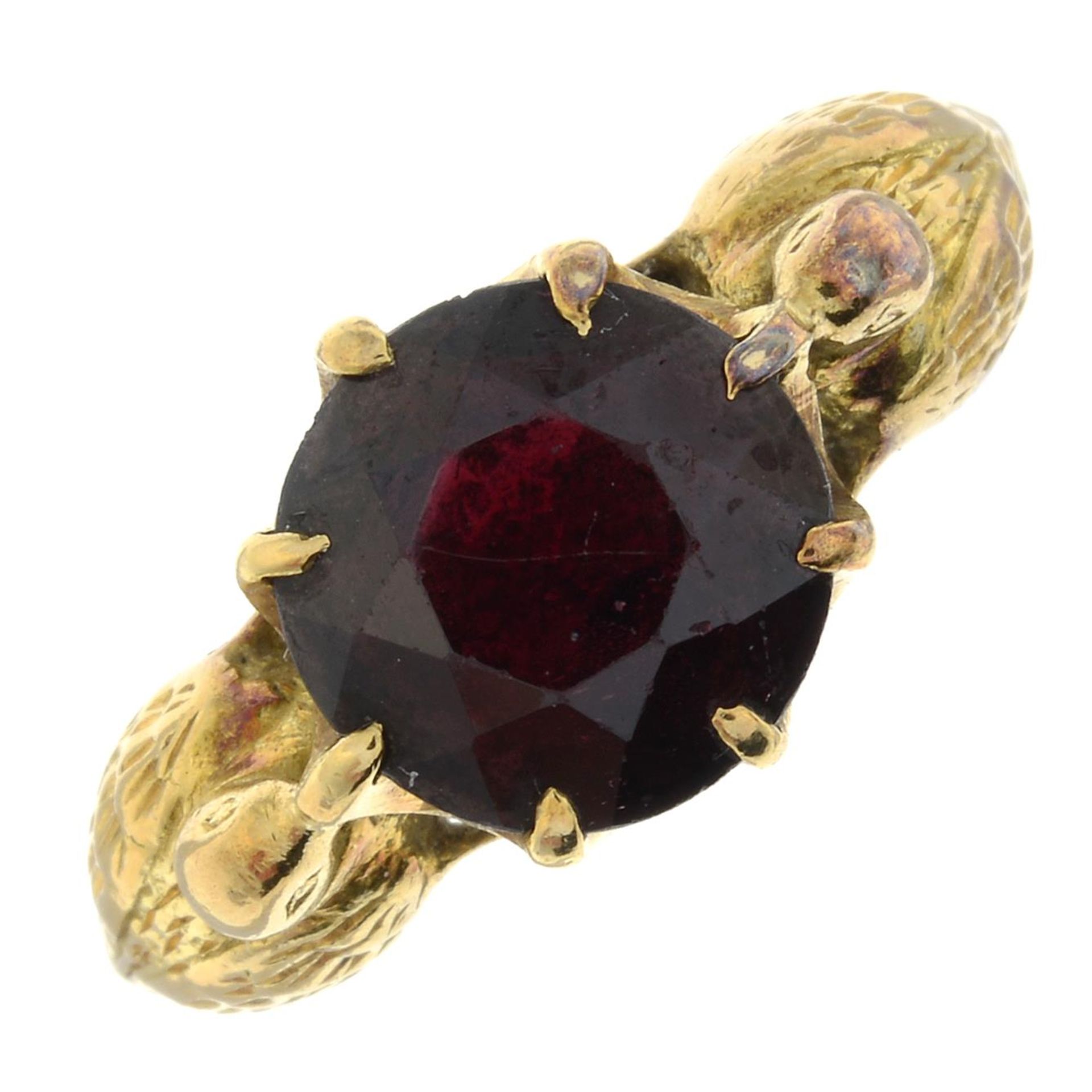A 1960s 18ct gold garnet single-stone ring, with stylised duck sides.
