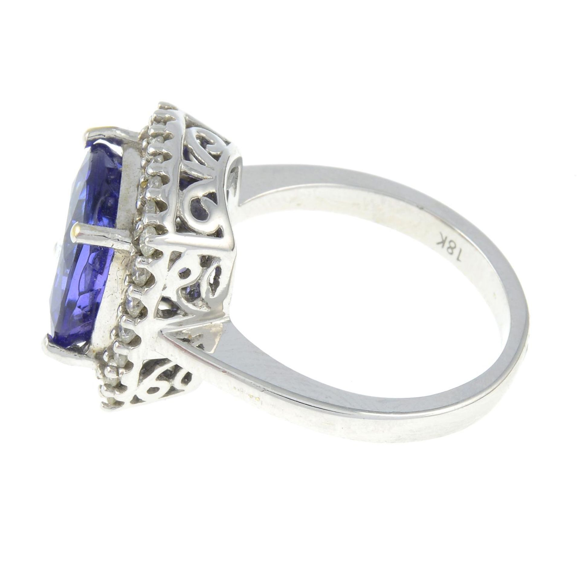 An 18ct gold tanzanite and brilliant-cut diamond cluster ring.Tanzanite calculated weight 5.92cts, - Image 2 of 3